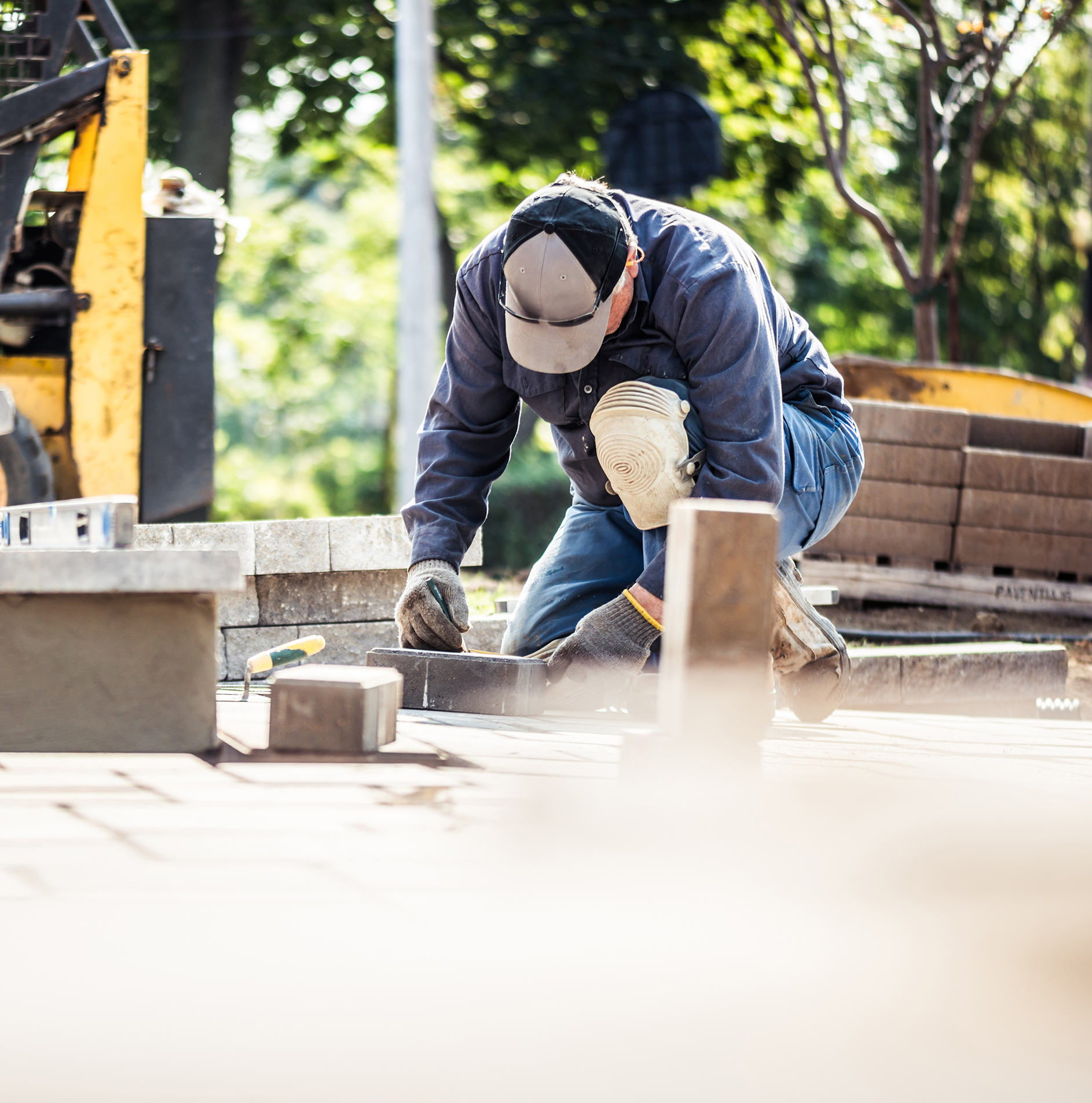 Man laying pavers