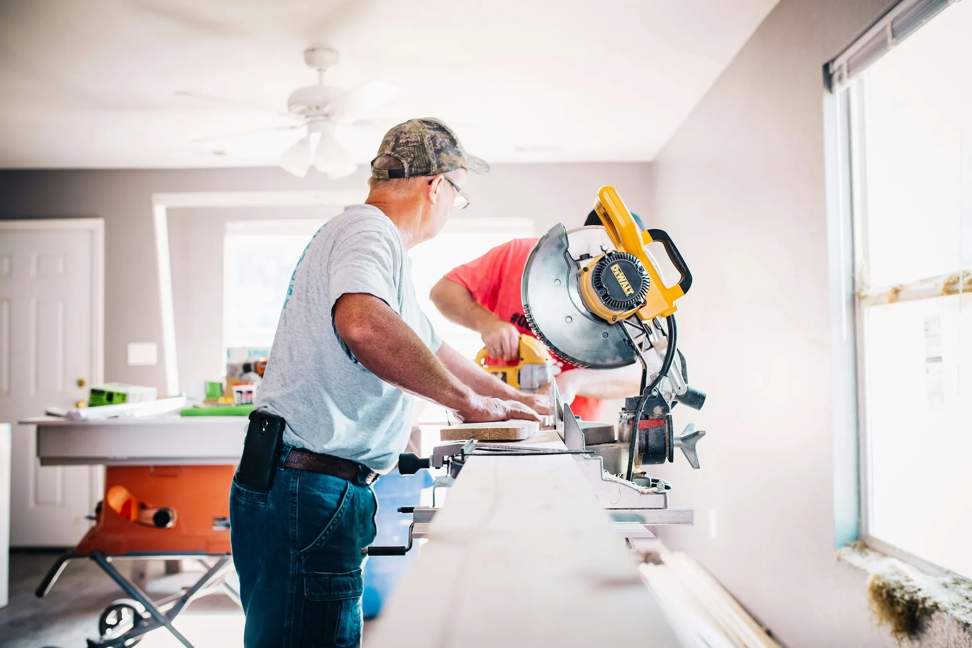 Two people working on roofing